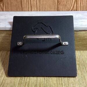 The Pampered Chef Black Grill Press with Silver Handle